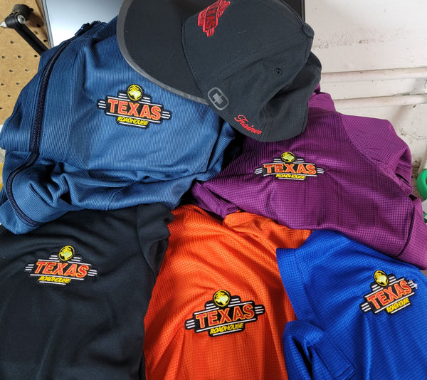 Various embroidered lightweight polos and quarter zips for Texas Roadhouse