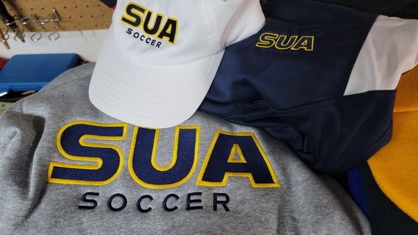 Embroidered hat, sweatshirt, and jacket for Saint Ursala Academy