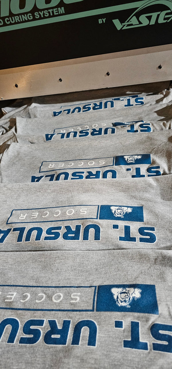 A batch of 2-color screenprinted tees for Saint Ursula Academy Soccer
