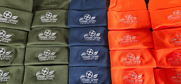 Embroidered beanies for Village Green Foundation
