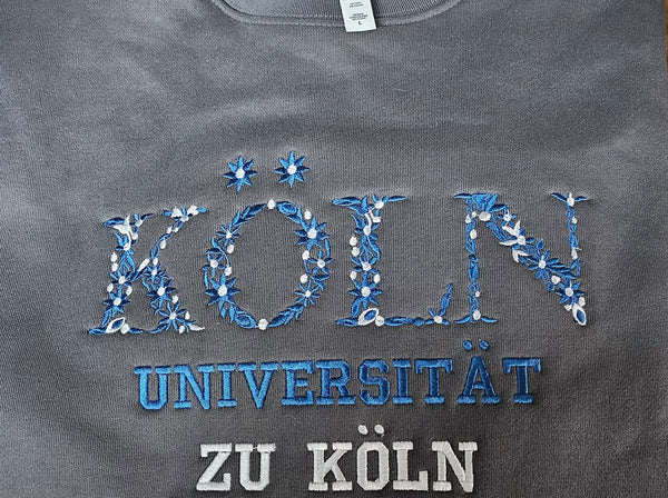 Embroidered sweatshirt for student headed to Universität zu Köln